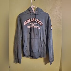 This is a green hollister hoodie men's Large